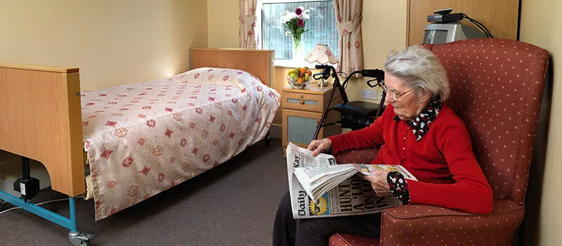 A bright, comfortable resident bedroom at Vicarage Farm Care Home