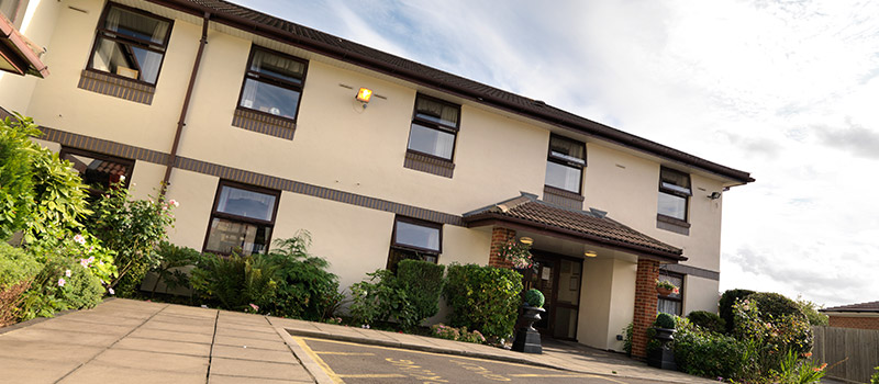The entrance and exterior of Vicarage Farm Care Home in Hounslow
