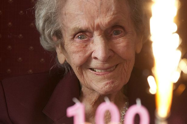 A volunteer spending time with a resident at Vicarage Farm Care Home